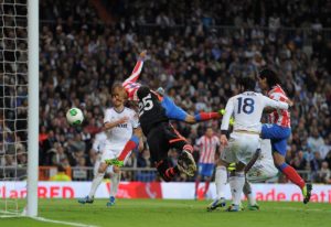 MADRID, SPAIN - MAY 17: Joao Miranda (L) of Club Atletico de Madrid beats Diego Lopez of Real Madrid to score Atletico's second goal during the Copa del Rey Final between Real Madrid CF and Club Atletico de Madrid at Estadio Santiago Bernabeu on May 17, 2013 in Madrid, Spain. (Photo by Denis Doyle/Getty Images)